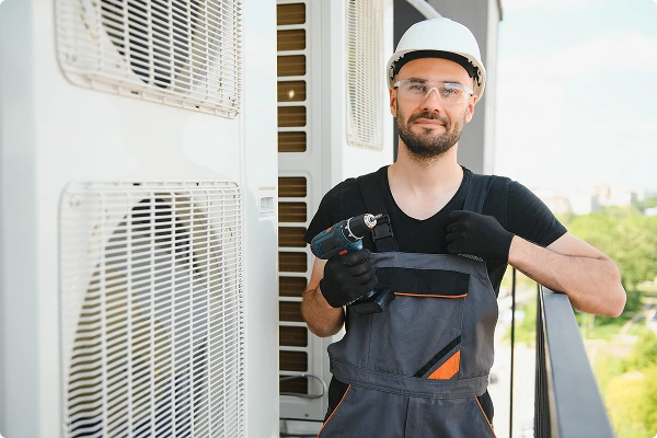 handsome plumber holding monkey wrench