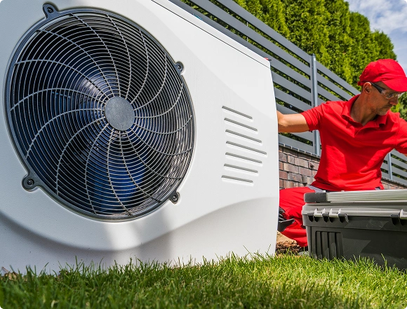 A man repairs the heating system.