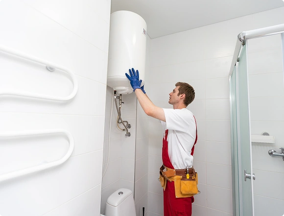 A man repairs a boiler
