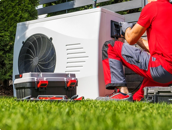 A man repairs the heating system.