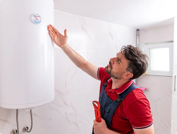 A man repairs a boiler