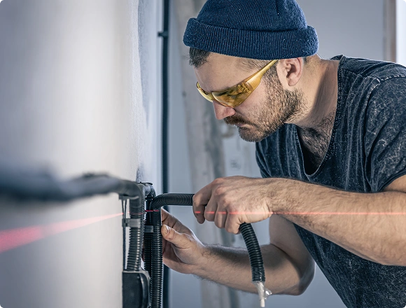 A man repairs a boiler