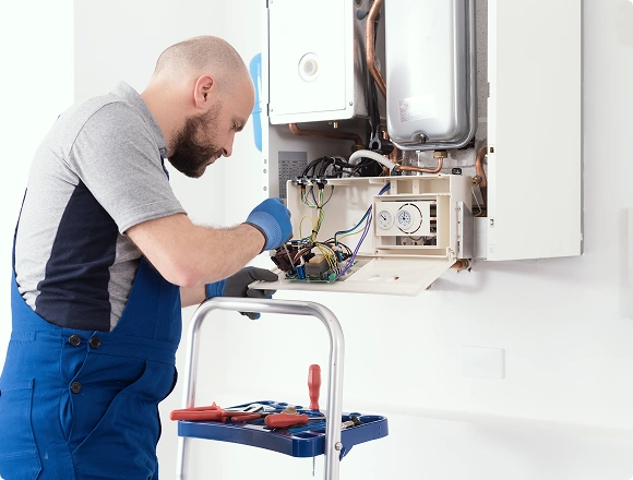 A man installs a heater.