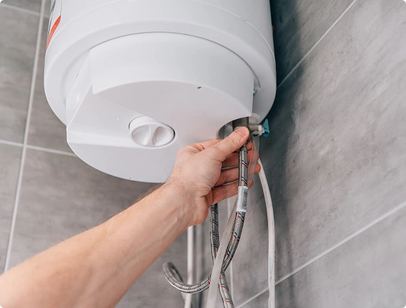 A man installs a heater.