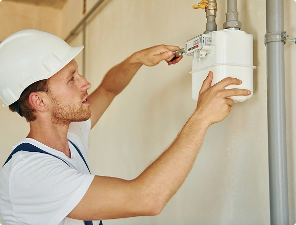 man repairs gas station