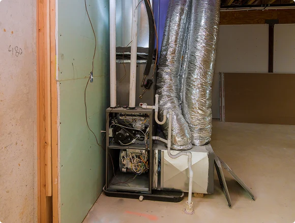 Residential furnace system with exposed ductwork in a basement