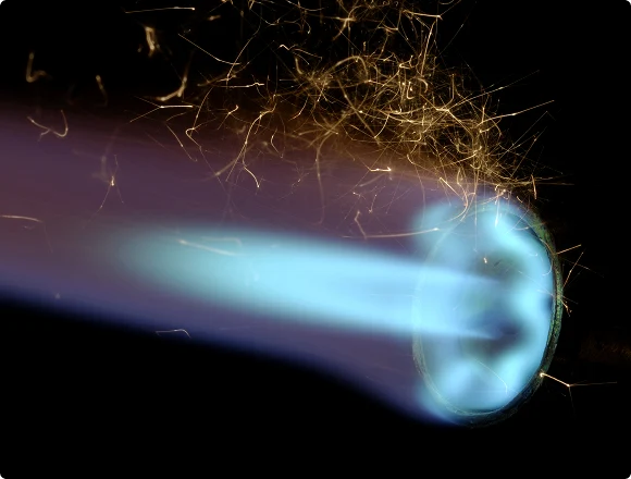 Close-up of a gas burner flame inside a heating system