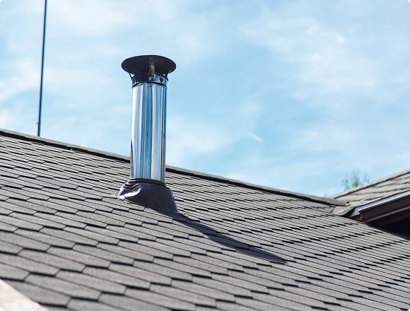 Residential roof chimney vent for a home heating system