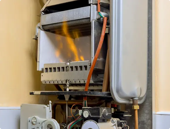 Gas burner operating inside an open heating unit.