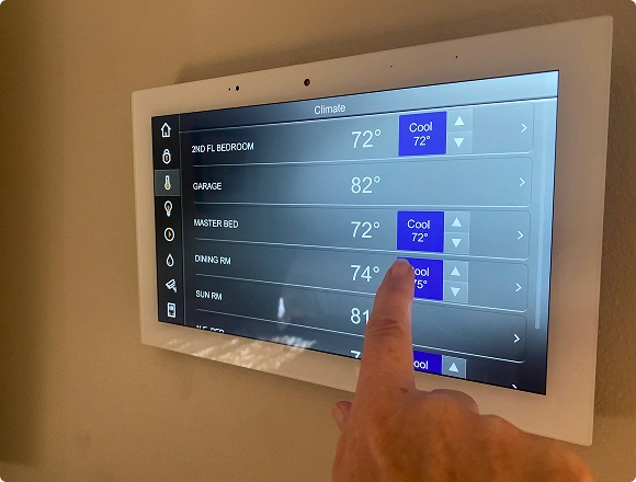 Touchscreen smart home thermostat interface used to control temperature in multiple rooms