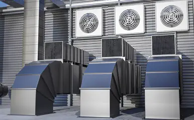 Industrial HVAC ventilation ducts and air handling units in a mechanical room